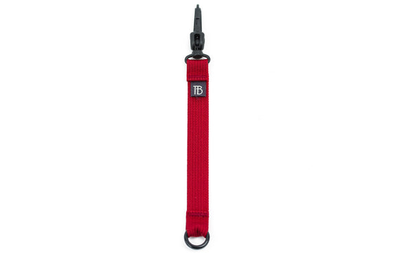 An 8-inch Iberian (red) Key Strap with a snaphook at one end and an o-ring at the other.
